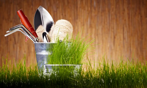 Seasonal lawn maintenance in The Hale showing healthy turf and garden upkeep